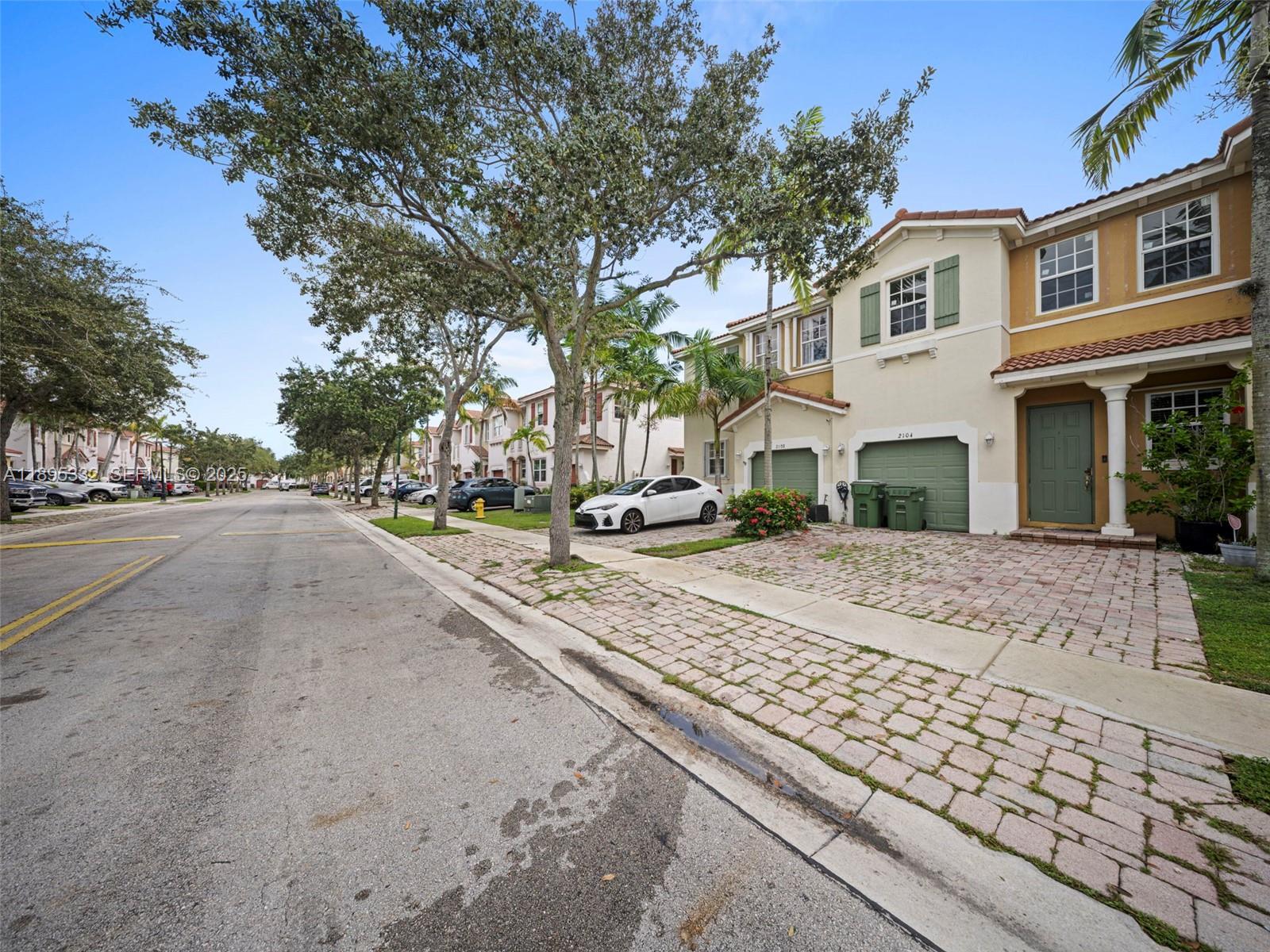 2104 Northeast 3rd Court Homestead, FL 33033 - Photo 3 of 35 a view of road with a houses