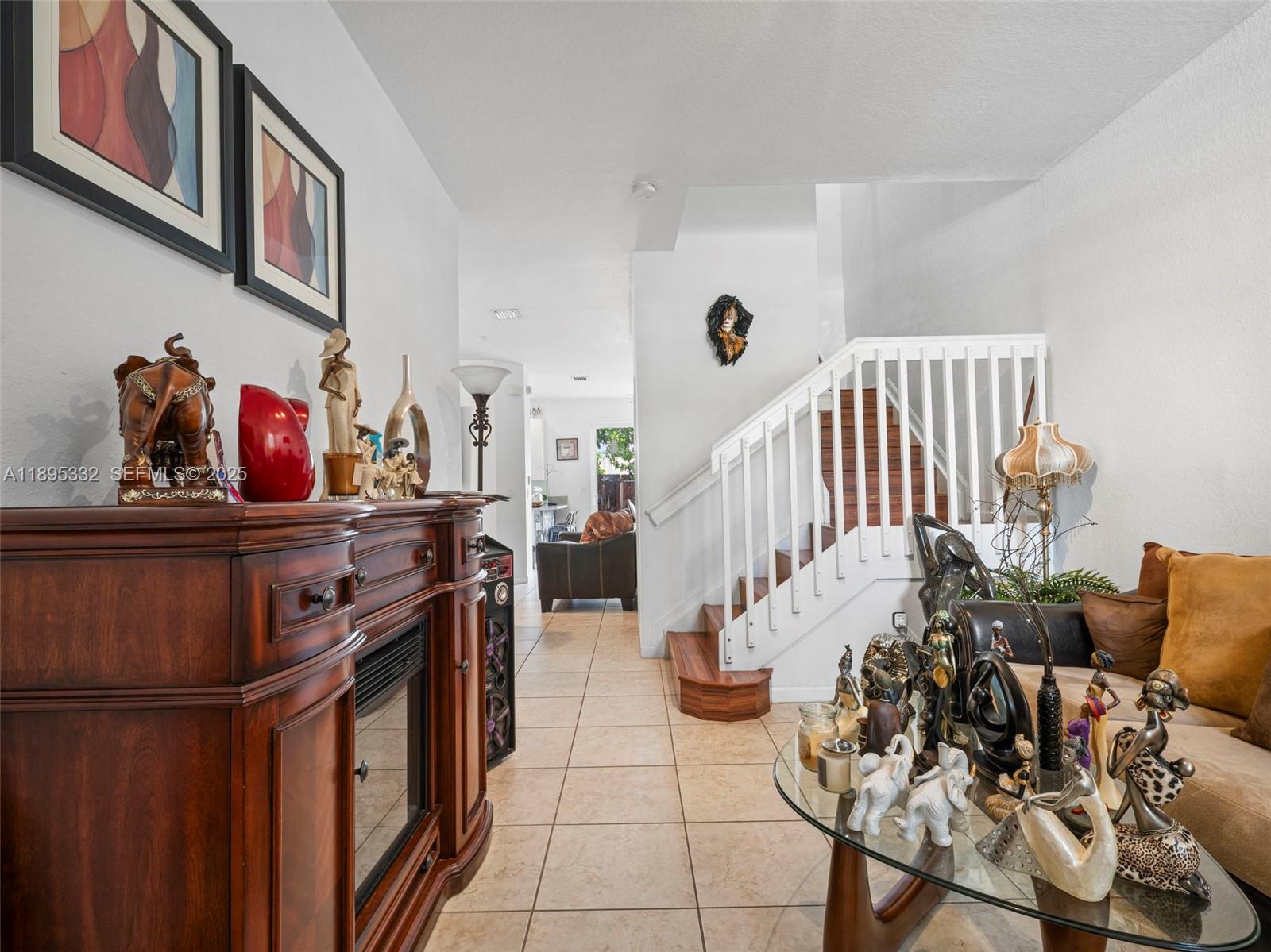 2104 Northeast 3rd Court Homestead, FL 33033 - Photo 5 of 35 a view of an entryway and livingroom with furniture