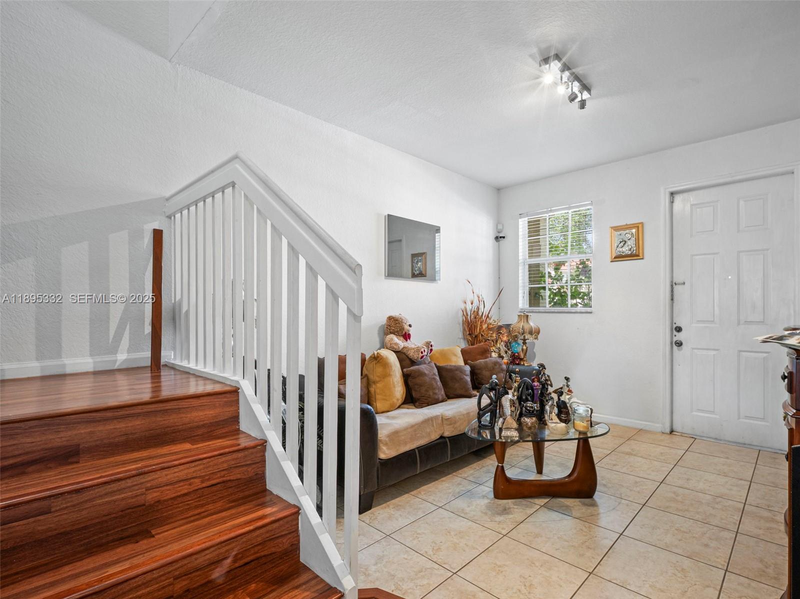 2104 Northeast 3rd Court Homestead, FL 33033 - Photo 6 of 35 a living room with furniture and wooden floor