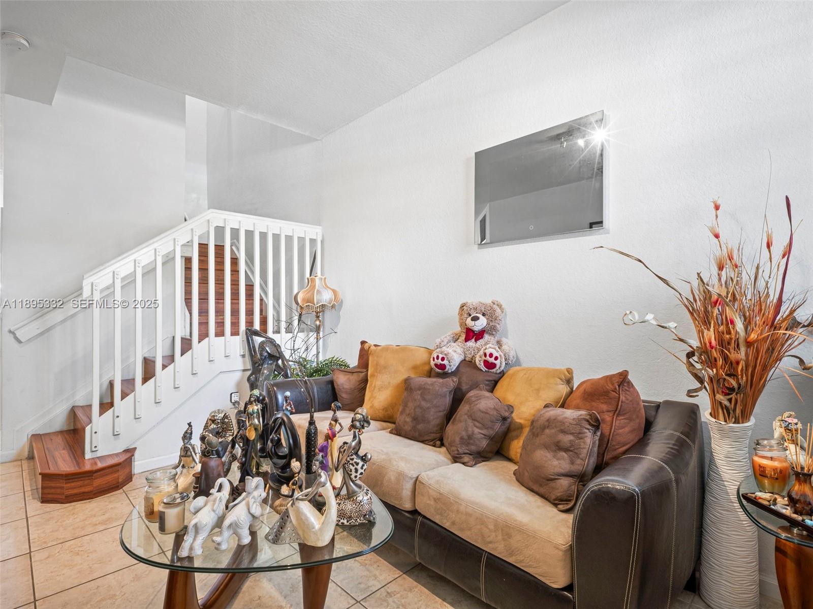2104 Northeast 3rd Court Homestead, FL 33033 - Photo 7 of 35 a living room with furniture and a flat screen tv