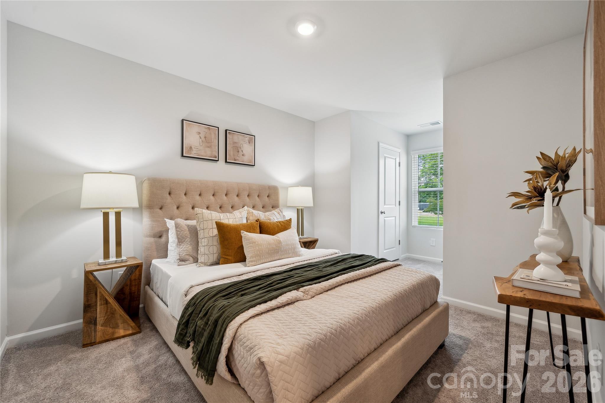 3021 Kingsfield Road, Unit 50 Charlotte, NC 28208 - Photo 5 of 8 a bed room with a bed and a lamp