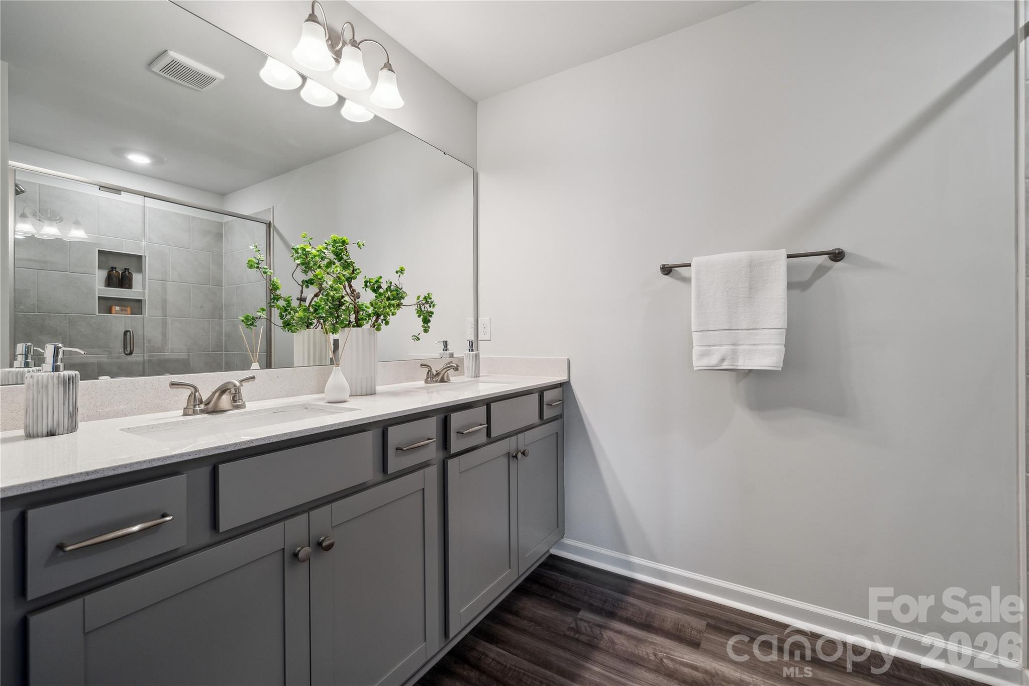 3021 Kingsfield Road, Unit 50 Charlotte, NC 28208 - Photo 6 of 8 a bathroom with a sink and a mirror