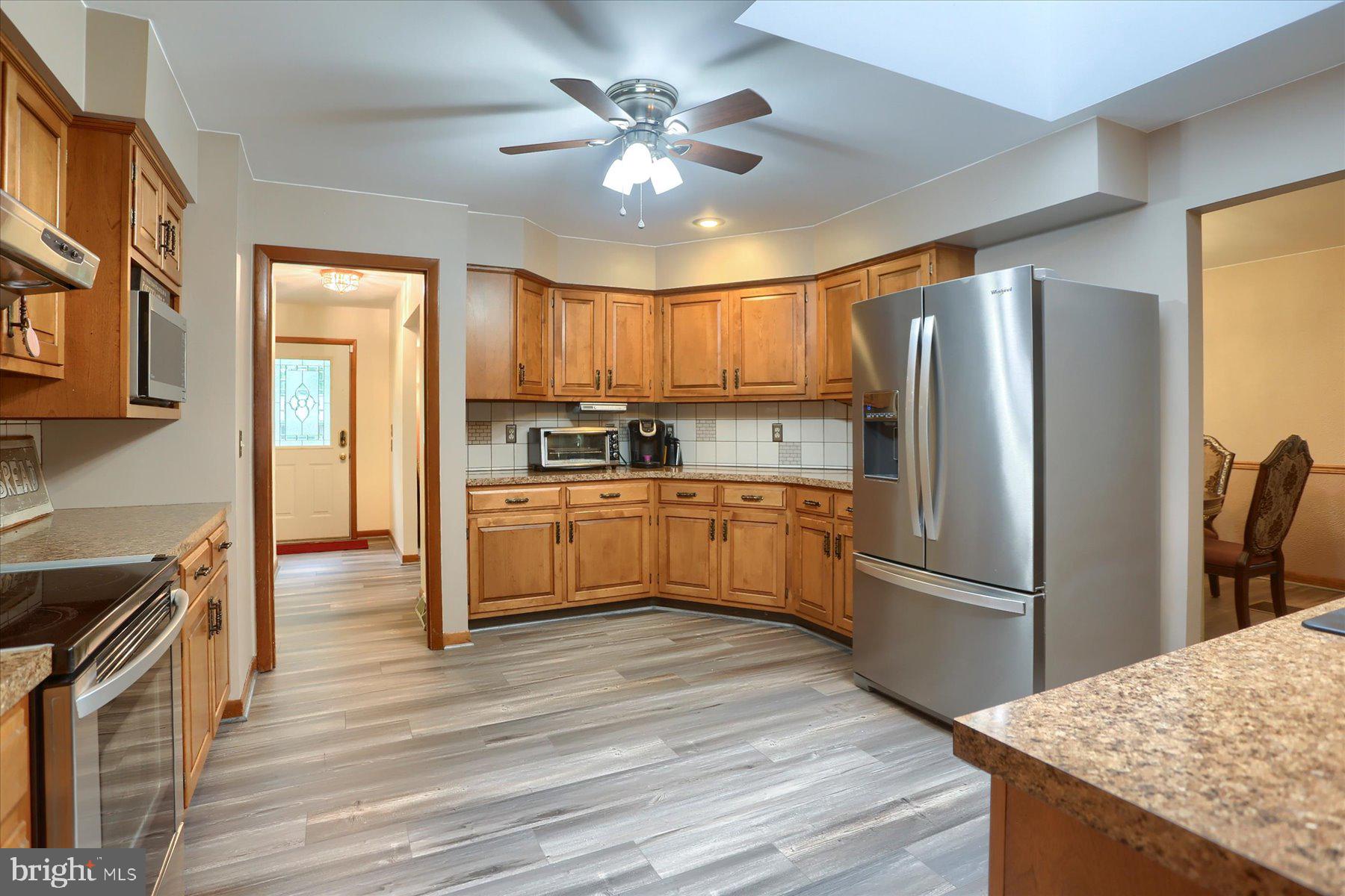12 South Ridge Road Boiling Springs, PA 17007 - Photo 9 of 39 a kitchen with refrigerator cabinets and wooden floor
