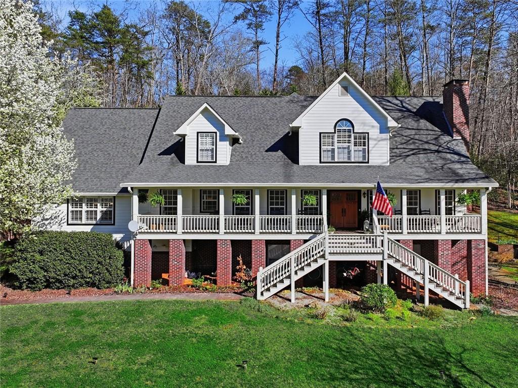 1852 Oak Grove Road Dahlonega, GA 30533 - Photo 2 of 68 a view of a house with a yard and sitting area
