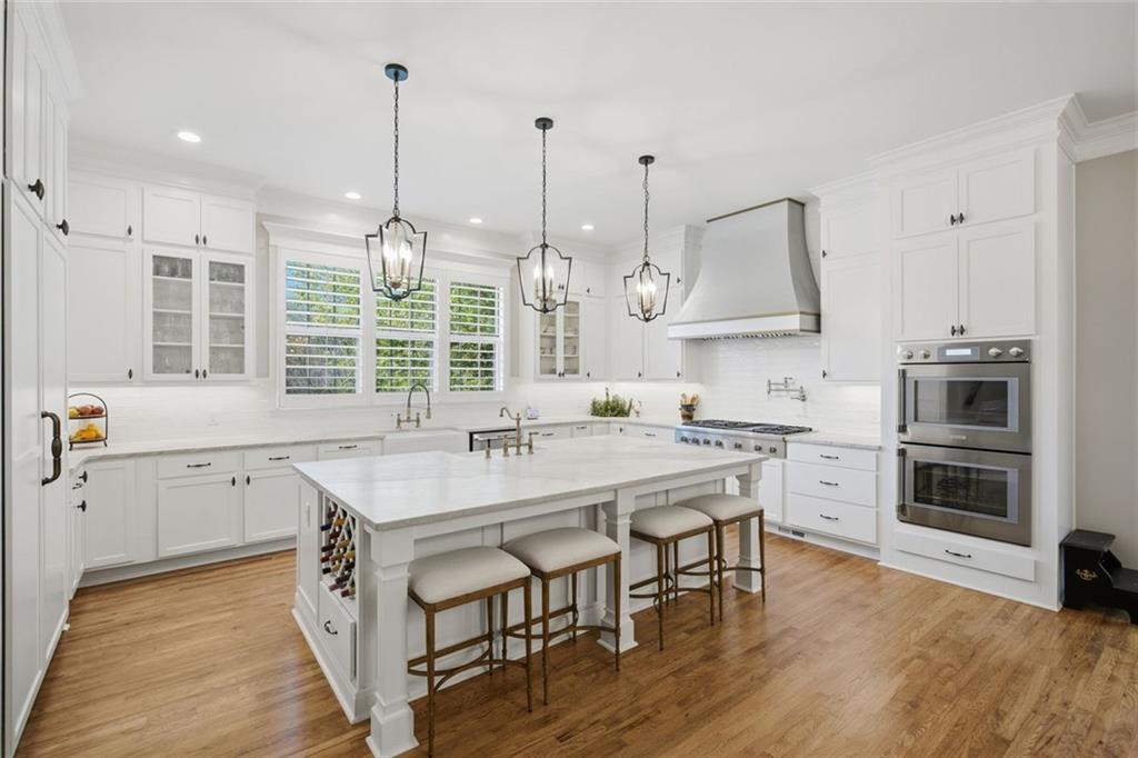 1852 Oak Grove Road Dahlonega, GA 30533 - Photo 28 of 68 a kitchen with stainless steel appliances granite countertop a stove a sink dishwasher and a refrigerator with wooden floor