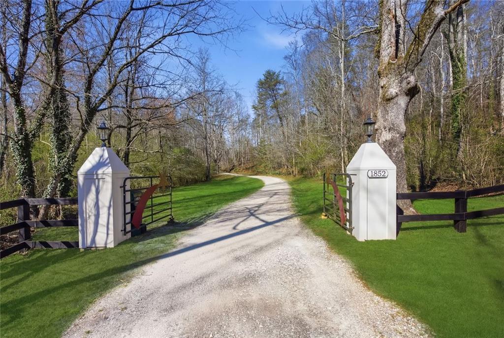 1852 Oak Grove Road Dahlonega, GA 30533 - Photo 3 of 68 a view of a park with iron fence