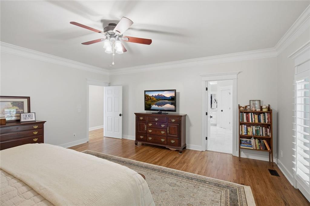 1852 Oak Grove Road Dahlonega, GA 30533 - Photo 40 of 68 a bedroom with a bed and a chandelier