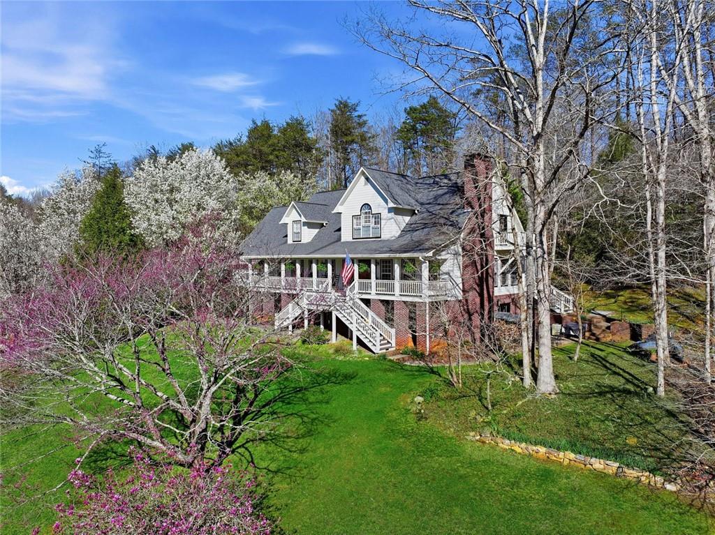 1852 Oak Grove Road Dahlonega, GA 30533 - Photo 4 of 68 front view of a house with a big yard