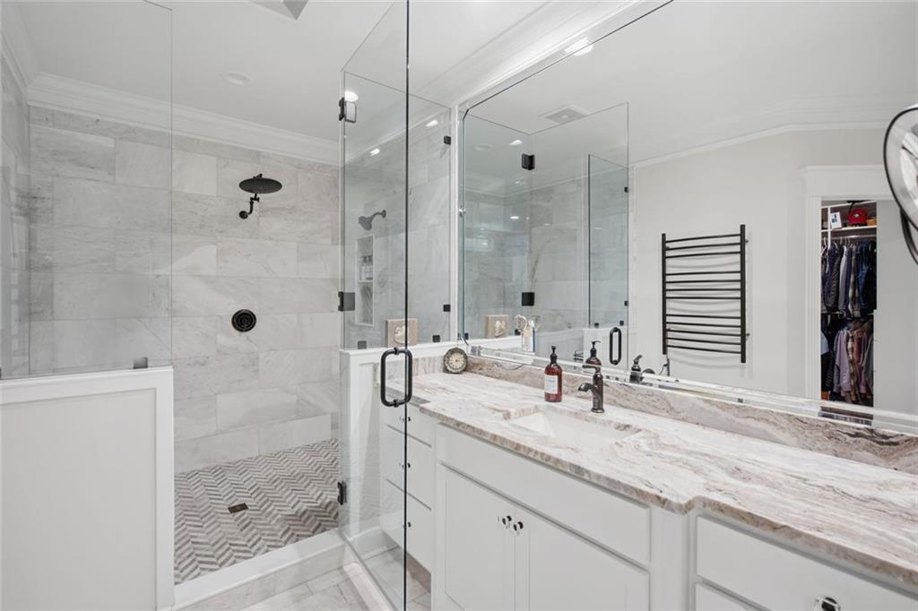 1852 Oak Grove Road Dahlonega, GA 30533 - Photo 41 of 68 a bathroom with a shower sink and mirror