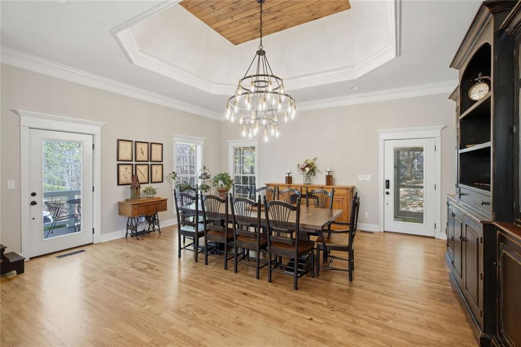 1852 Oak Grove Road Dahlonega, GA 30533 - Photo 44 of 68 a view of a dining room with furniture window and wooden floor