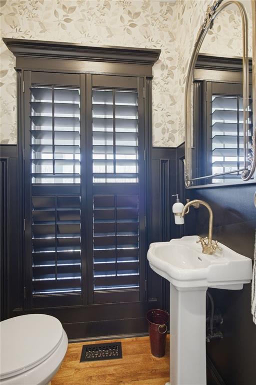 1852 Oak Grove Road Dahlonega, GA 30533 - Photo 50 of 68 a bathroom with a sink a toilet and mirror