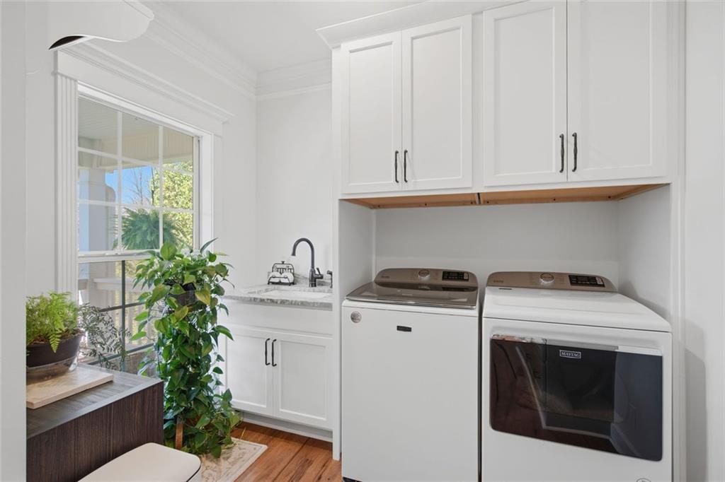 1852 Oak Grove Road Dahlonega, GA 30533 - Photo 53 of 68 a kitchen with stainless steel appliances white cabinets and a stove top oven