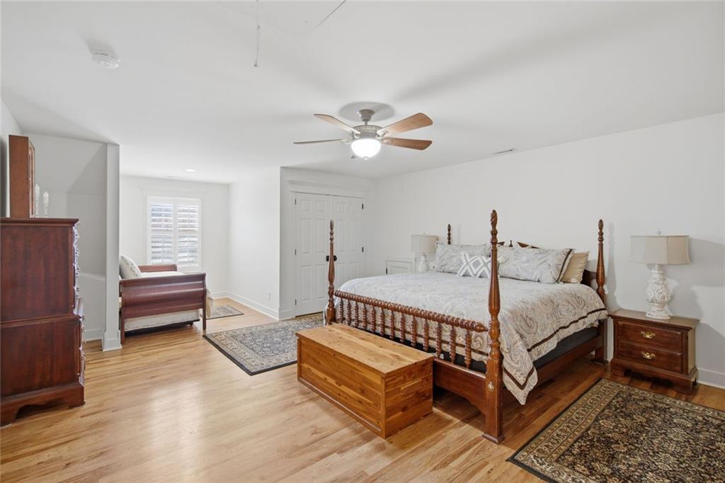 1852 Oak Grove Road Dahlonega, GA 30533 - Photo 60 of 68 a bed room with a bed and a chandelier