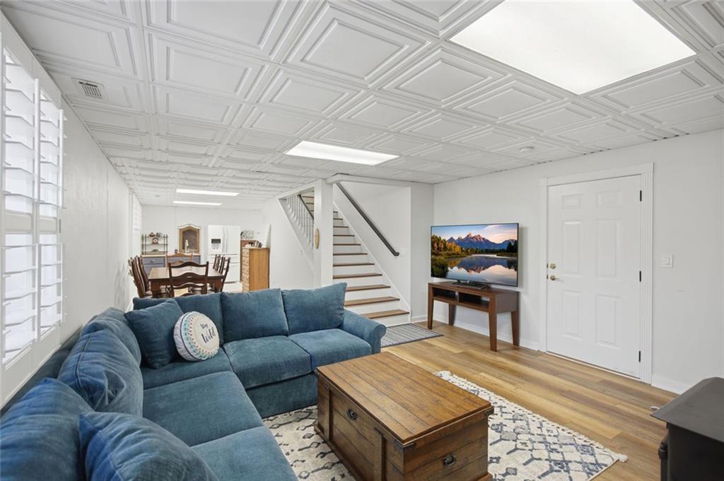 1852 Oak Grove Road Dahlonega, GA 30533 - Photo 62 of 68 a living room with furniture and a wooden floor