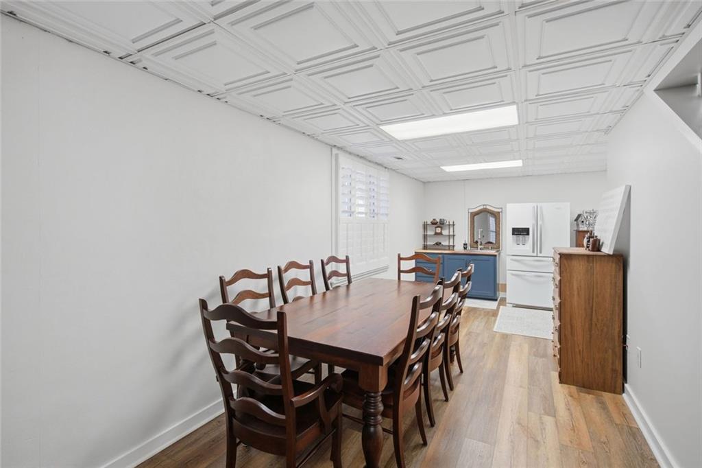 1852 Oak Grove Road Dahlonega, GA 30533 - Photo 63 of 68 a view of a dining room with furniture and wooden floor