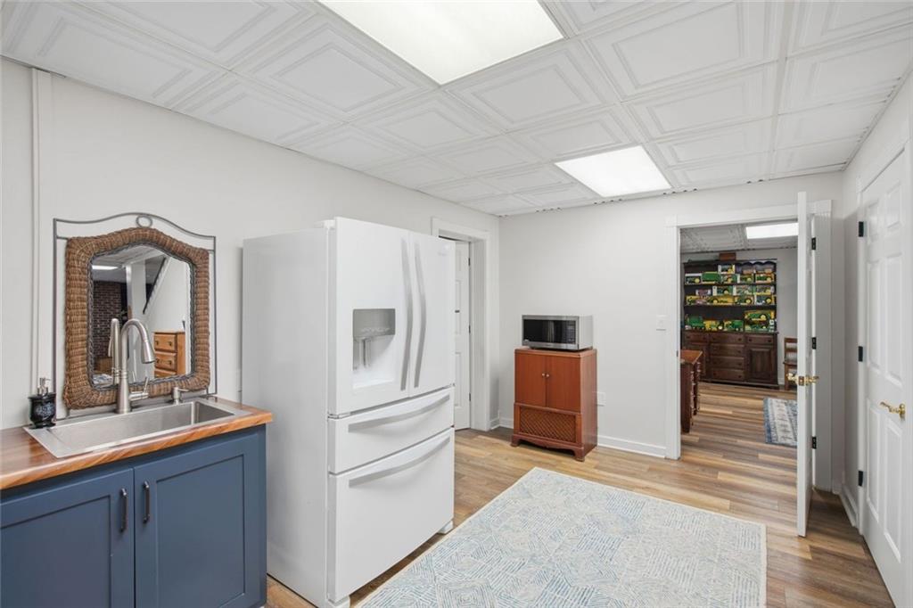 1852 Oak Grove Road Dahlonega, GA 30533 - Photo 64 of 68 a hallway with cabinets and wooden floor