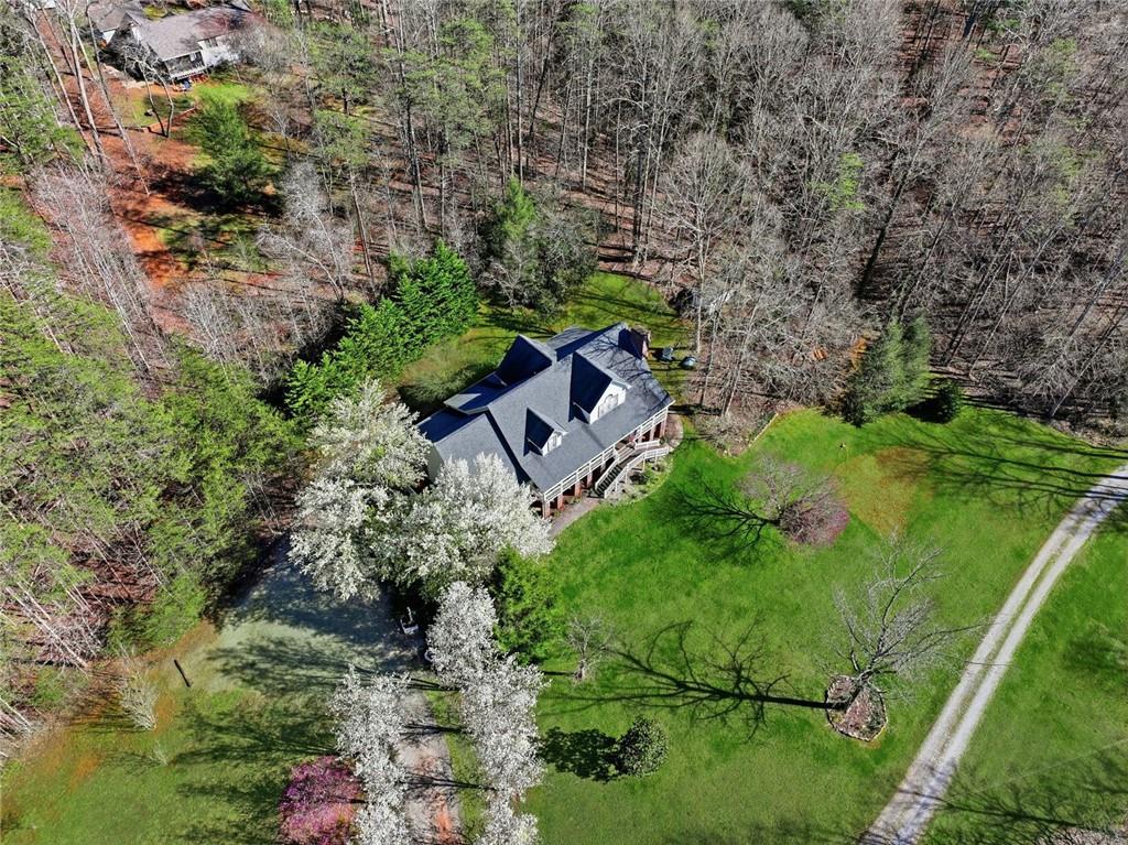 1852 Oak Grove Road Dahlonega, GA 30533 - Photo 8 of 68 an aerial view of a house with a yard
