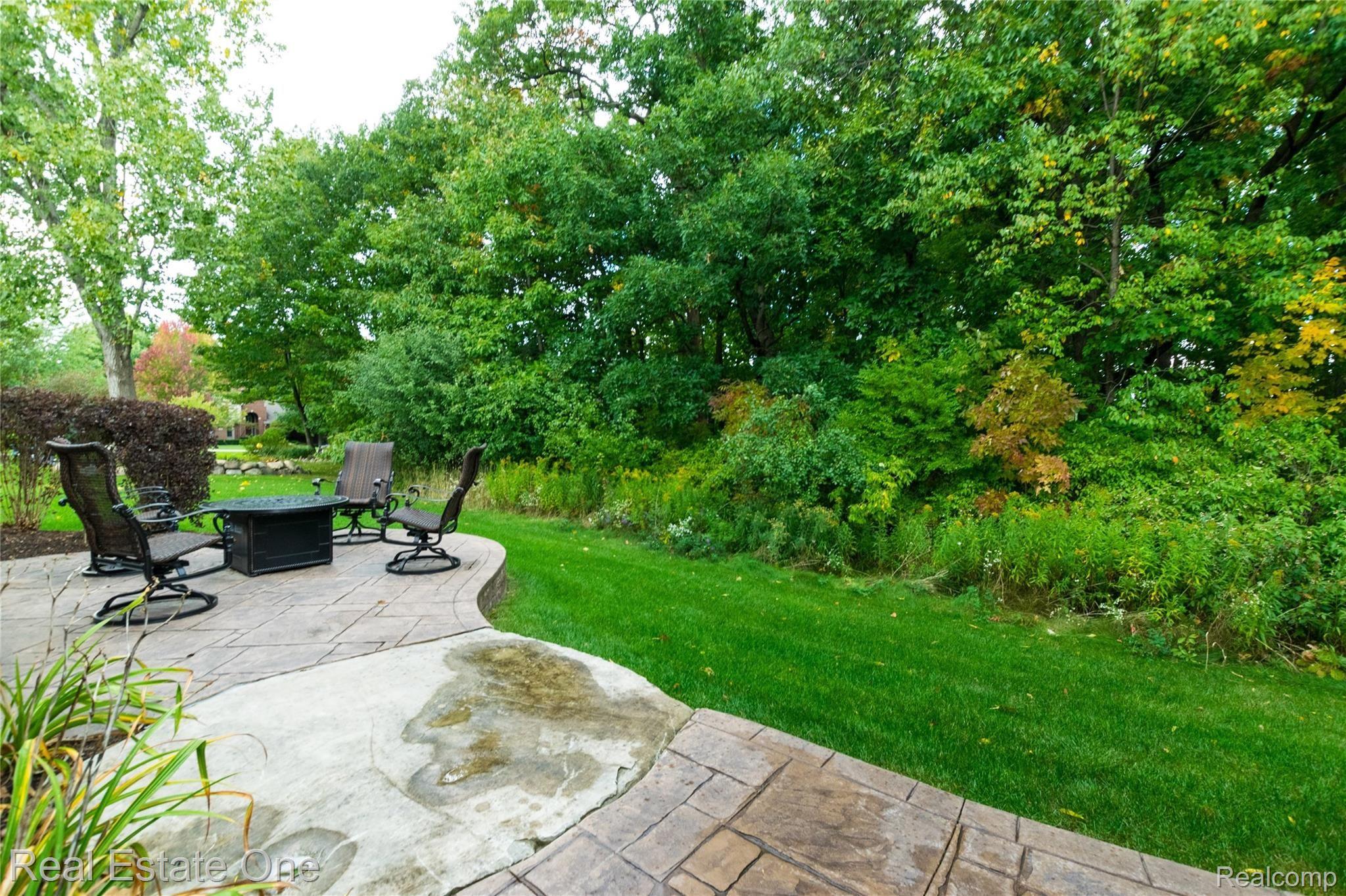 3959 Kaeleaf Road Lake Orion, MI 48360 - Photo 42 of 43 Wooded views! Firepit is natural gas and the sellers said "it will stay"!
