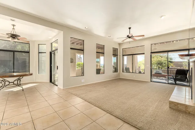 a view of a house with backyard porch and sitting area