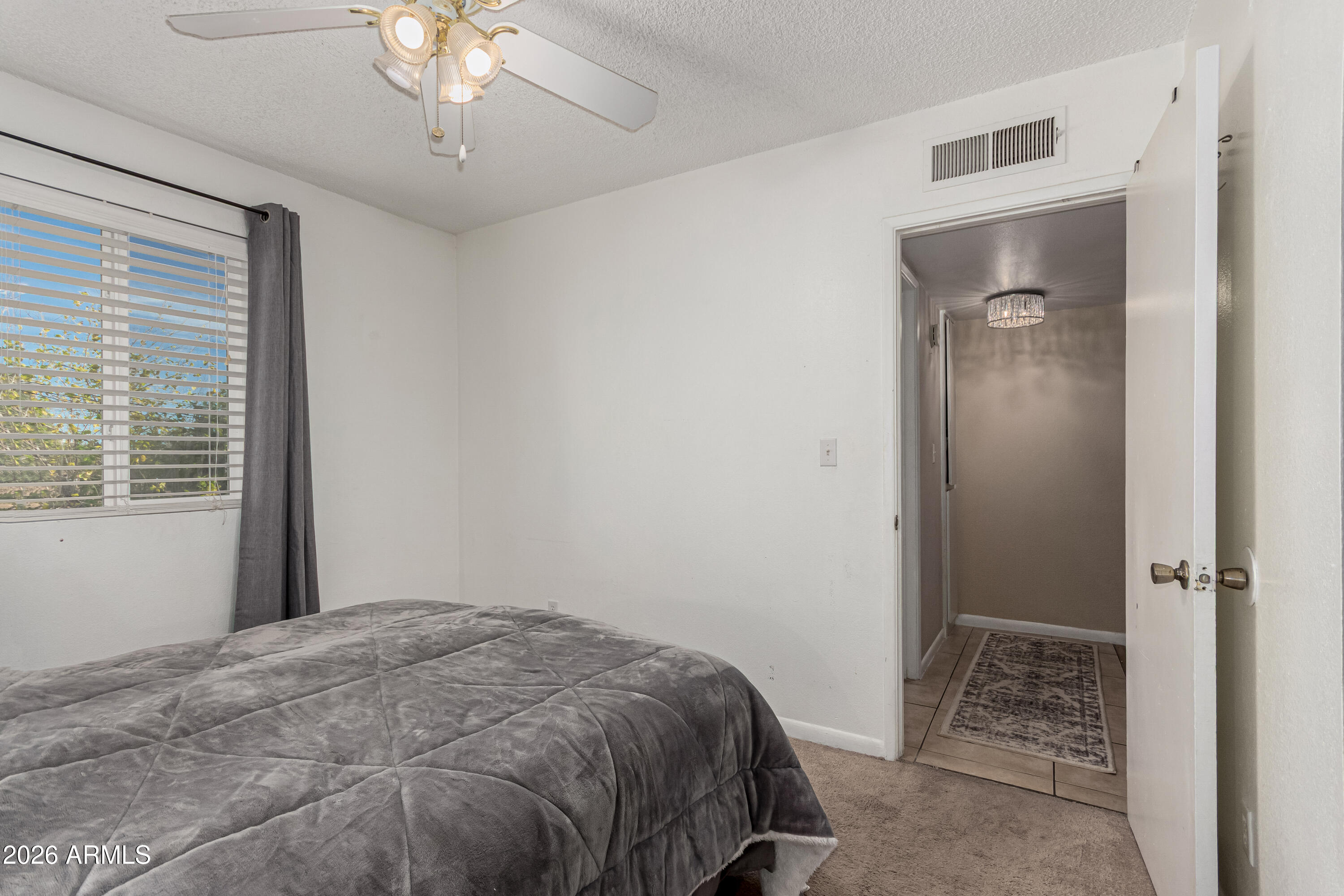 1531 West Colter Street, Unit 1 Phoenix, AZ 85015 - Photo 16 of 32 a bedroom with a bed and a window
