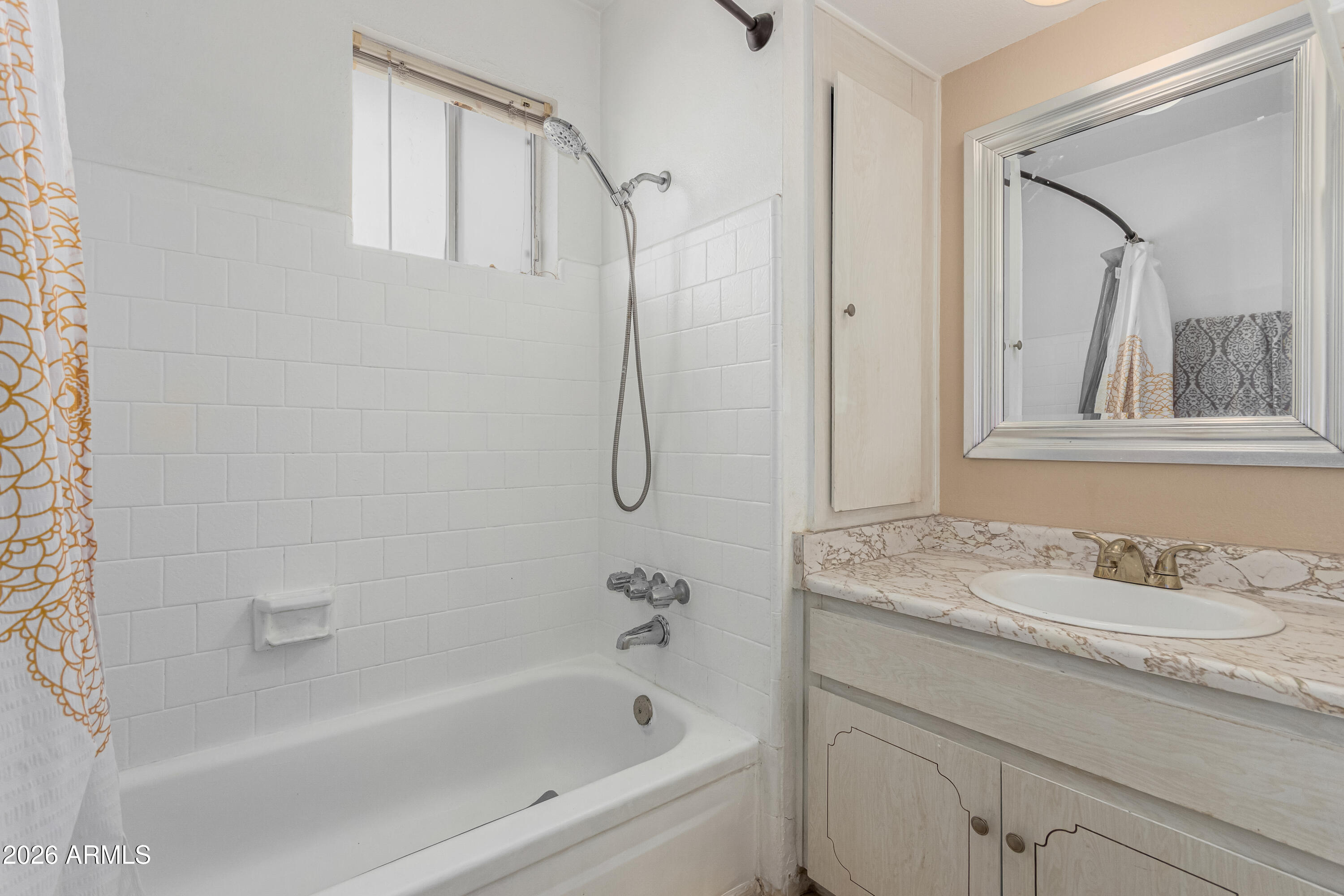 1531 West Colter Street, Unit 1 Phoenix, AZ 85015 - Photo 18 of 32 a bathroom with a granite countertop sink a mirror a vanity and bathtub