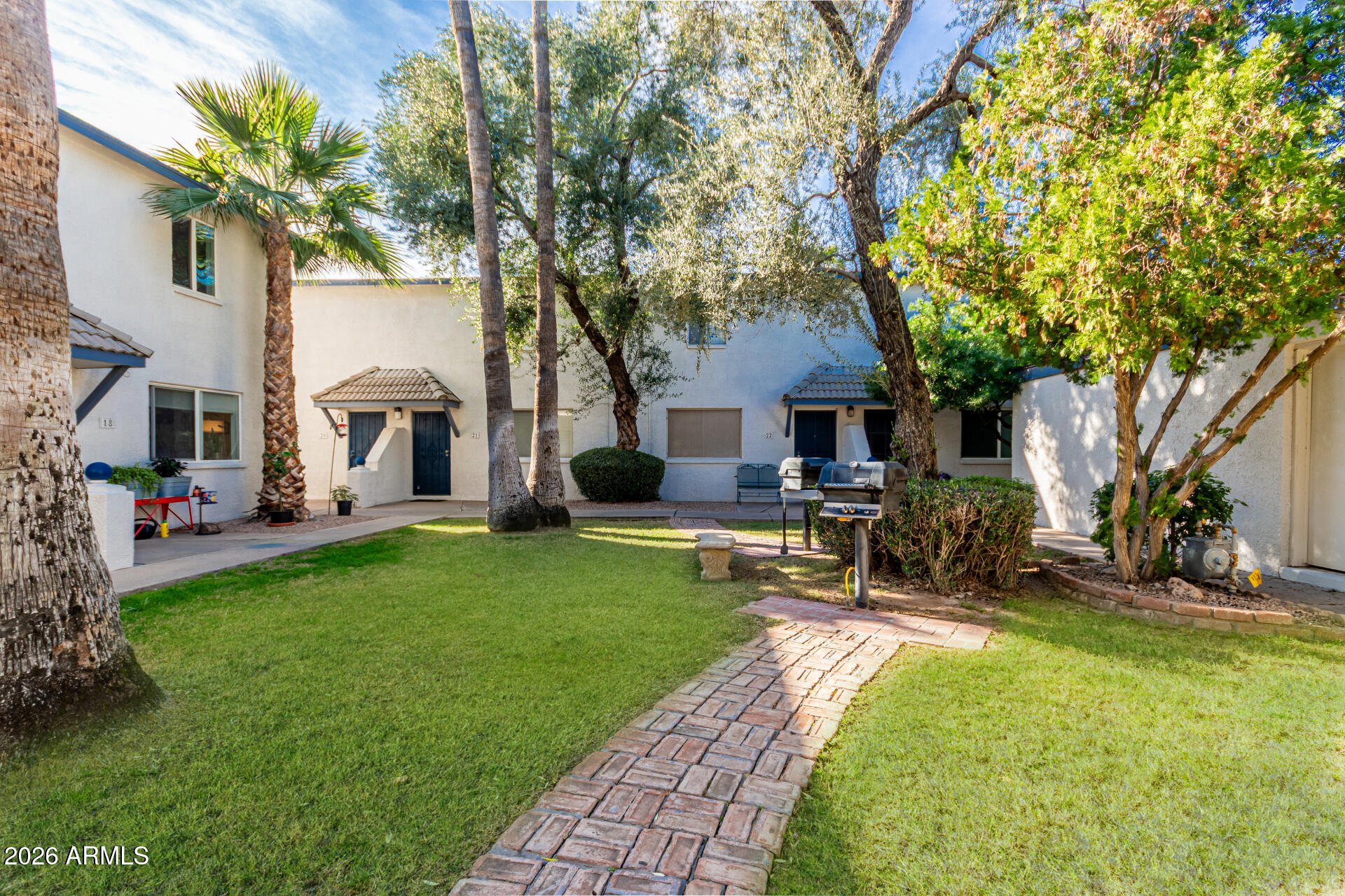 1531 West Colter Street, Unit 1 Phoenix, AZ 85015 - Photo 22 of 32 a view of a house with backyard sitting area and garden