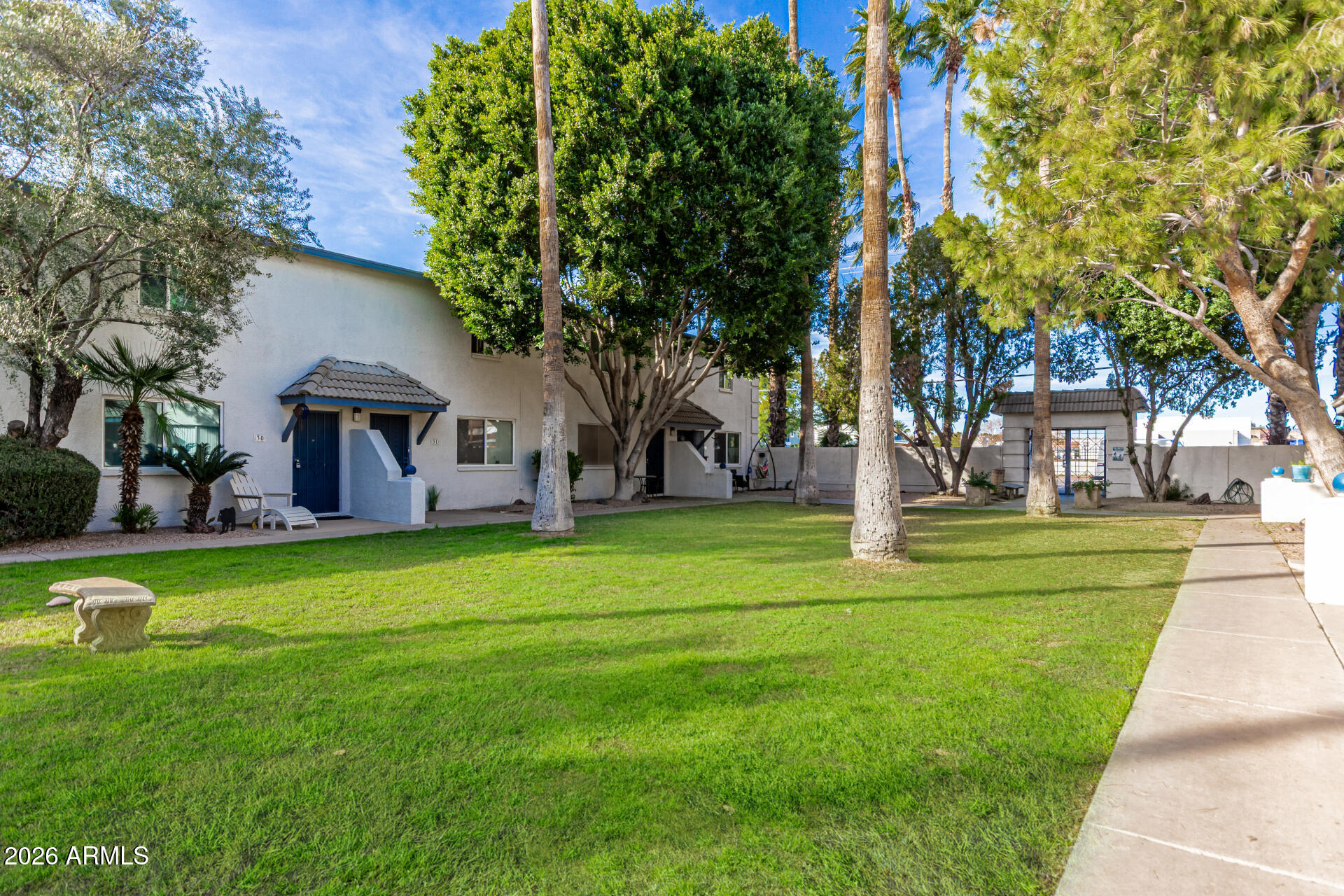 1531 West Colter Street, Unit 1 Phoenix, AZ 85015 - Photo 27 of 32 a front view of a house with a yard and trees