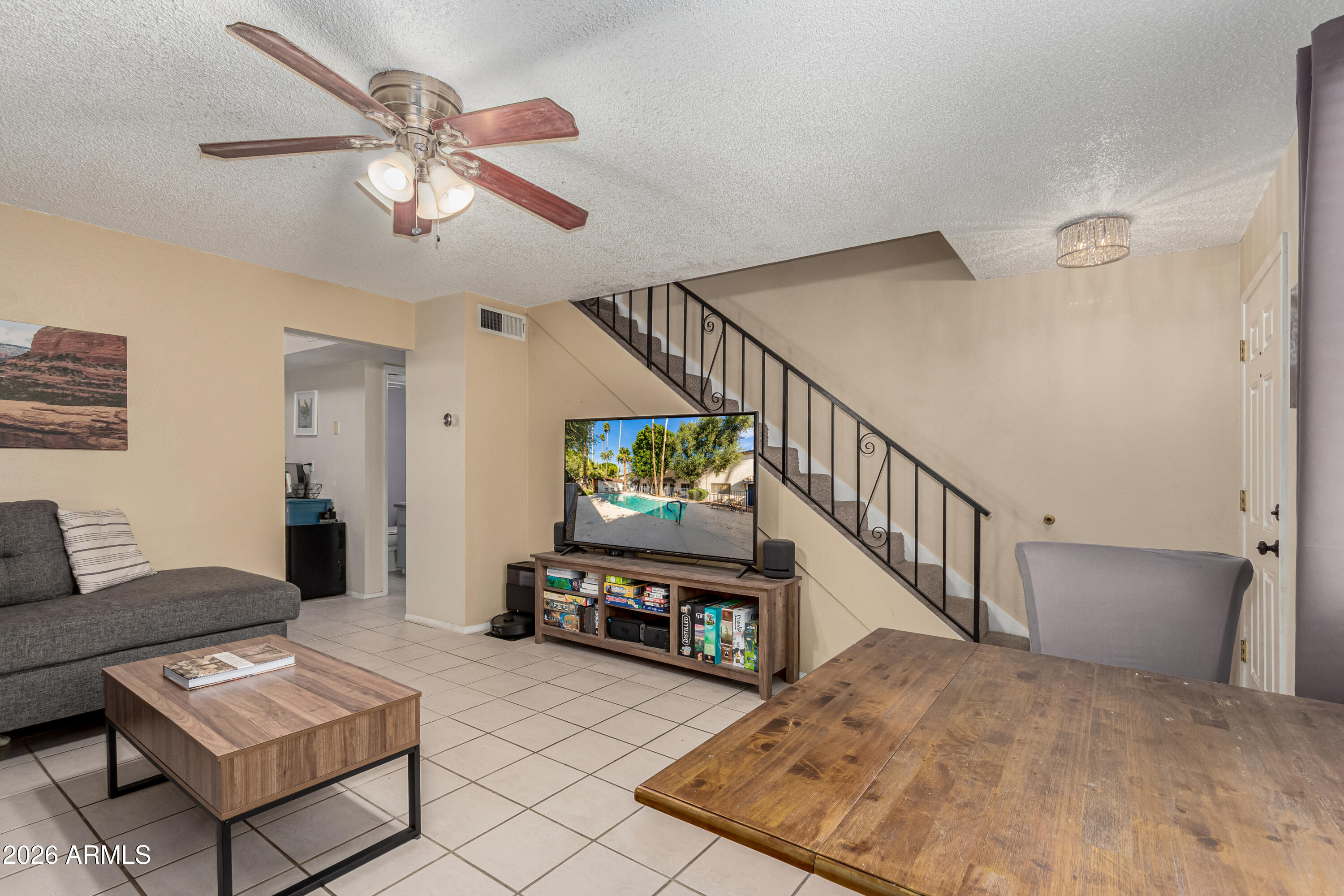 1531 West Colter Street, Unit 1 Phoenix, AZ 85015 - Photo 3 of 32 a living room with furniture and a flat screen tv