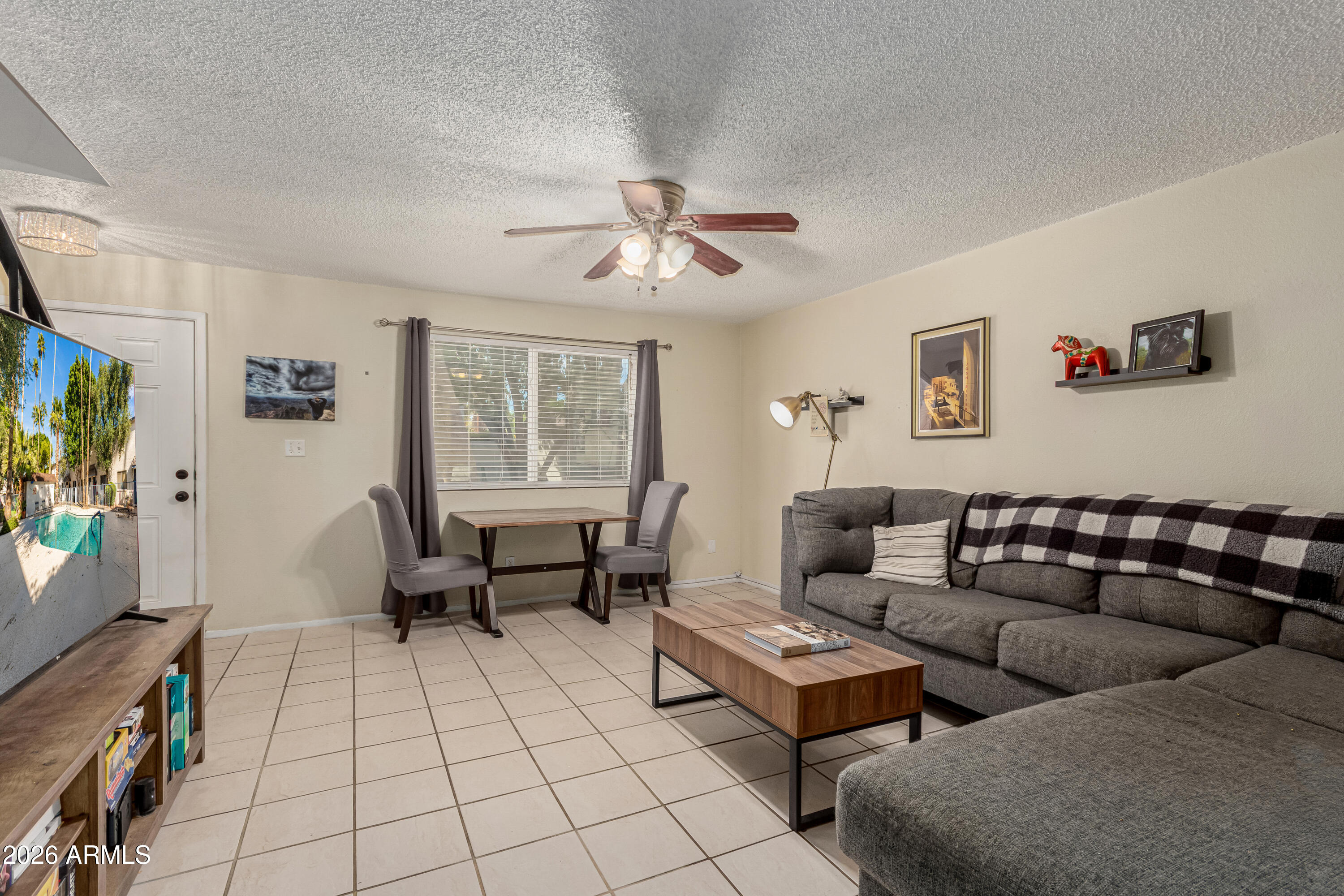 1531 West Colter Street, Unit 1 Phoenix, AZ 85015 - Photo 4 of 32 a living room with furniture and a flat screen tv