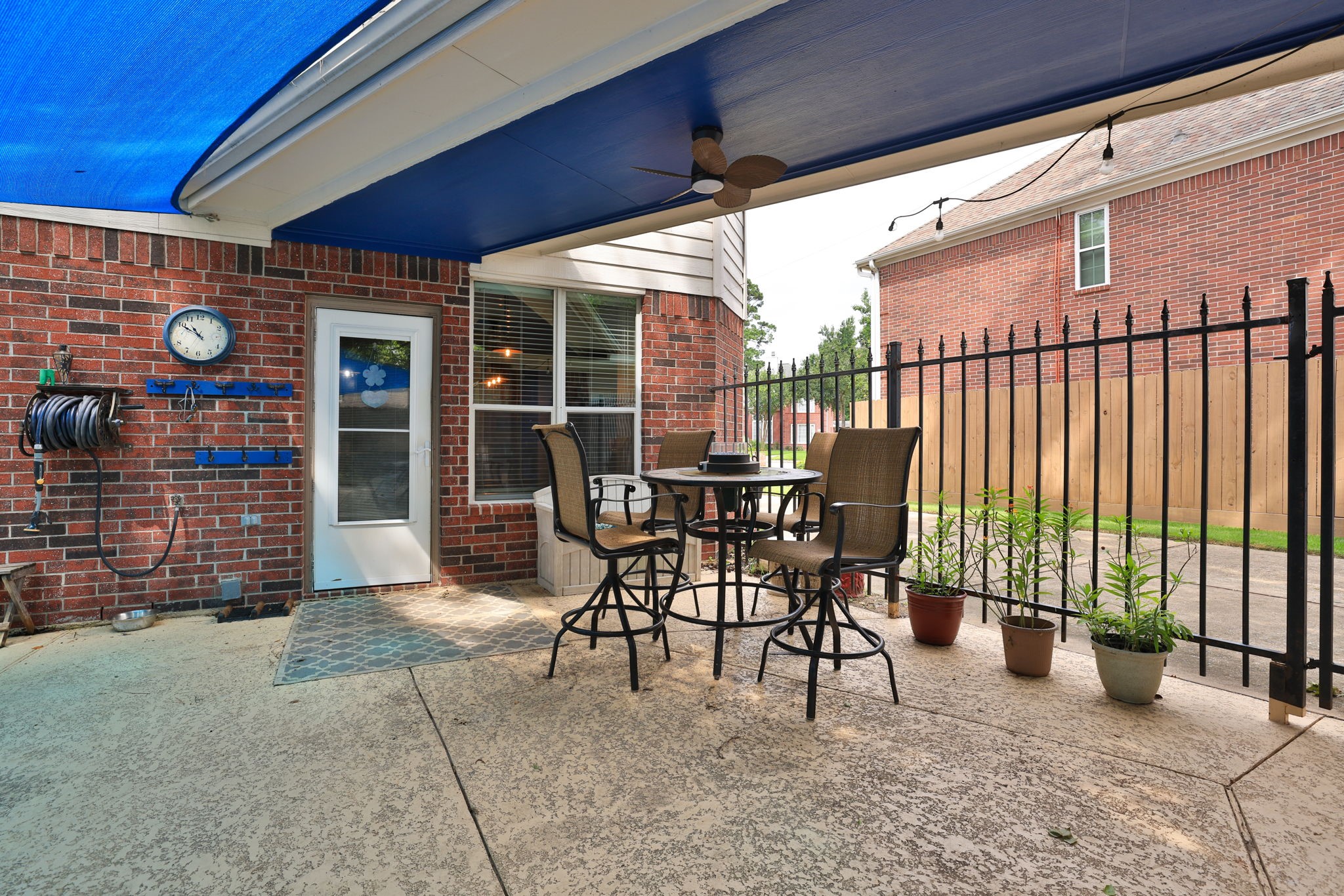 19114 Emory Trail Spring, TX 77388 - Photo 39 of 44 a view of a patio with table and chairs and wooden fence