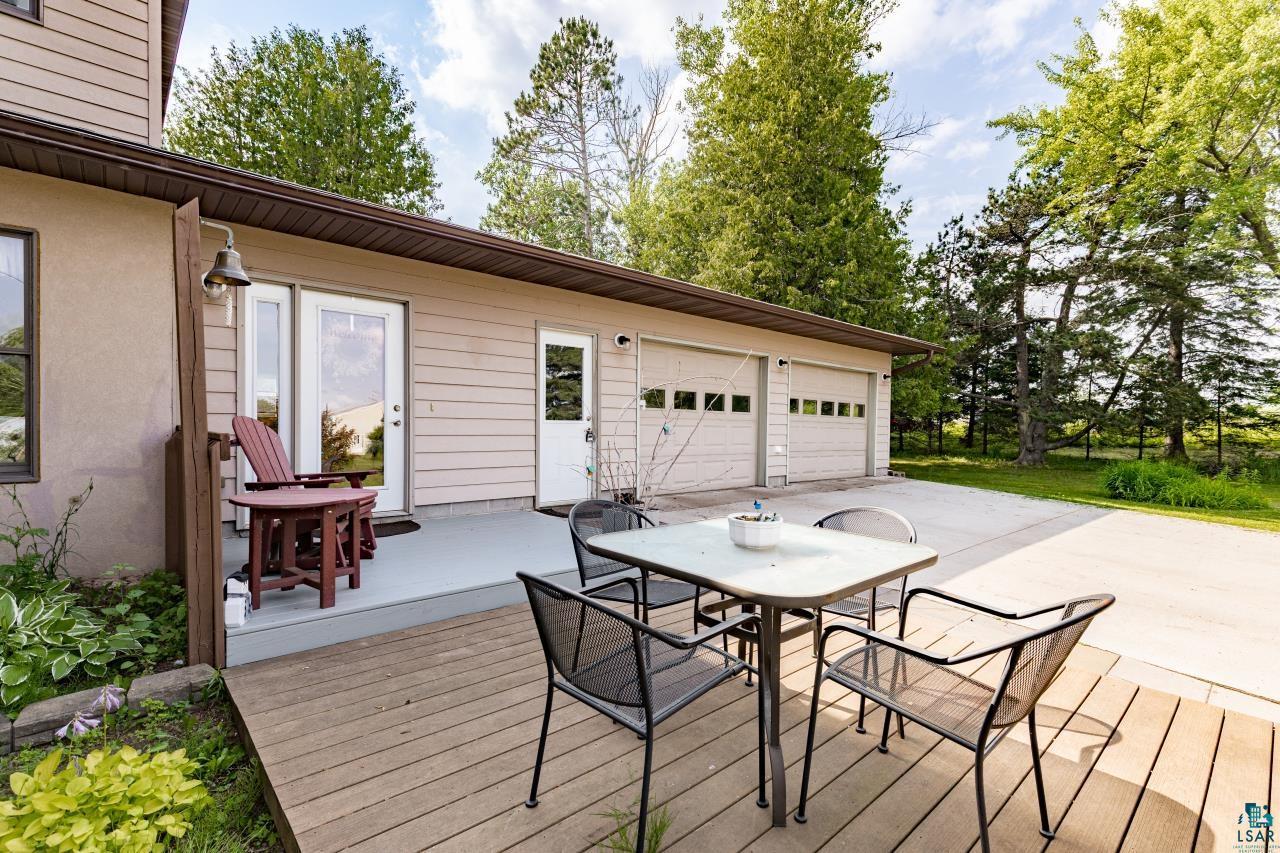 4800 Tower Road Moose Lake, MN 55767 - Photo 29 of 83 Expansive outdoor deck with concrete patio and two-car garage