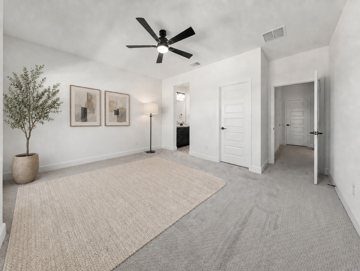 1440 Riva Ridge Drive Leander, TX 78641 - Photo 24 of 37 A well-lit bedroom featuring a textured rug and sleek overhead lighting, providing a serene retreat.