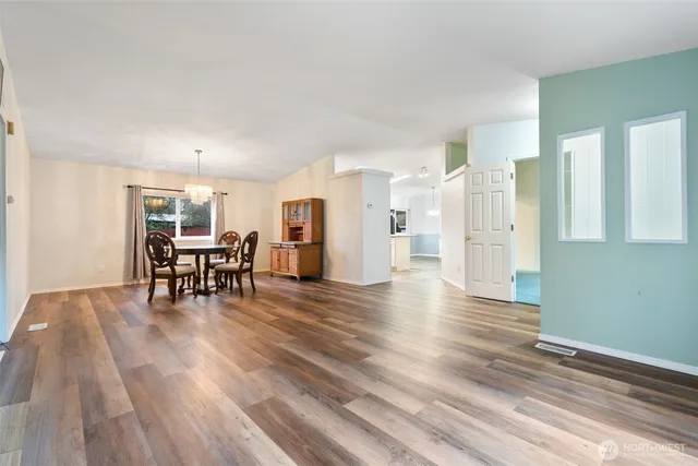 a view of a livingroom with furniture and wooden floor