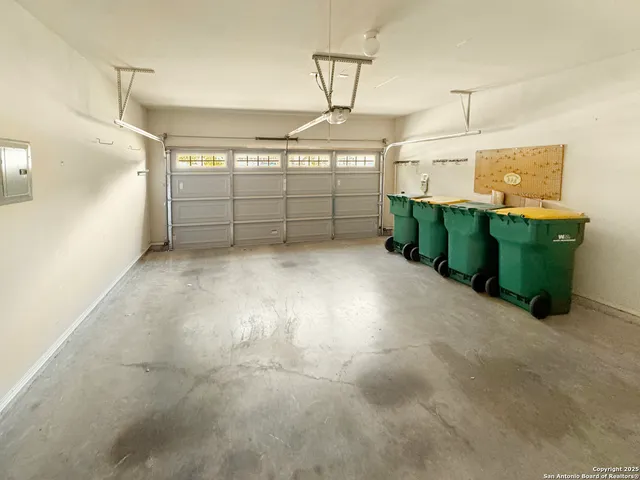 an empty room with wooden floor and window