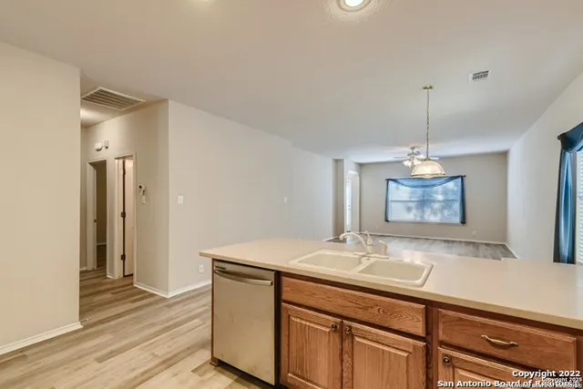 a kitchen with microwave cabinets and a stove top oven