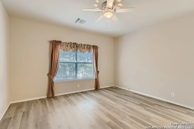 a spacious bathroom with a double vanity sink mirror and