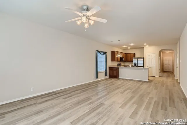 a view of a kitchen with a sink and a window