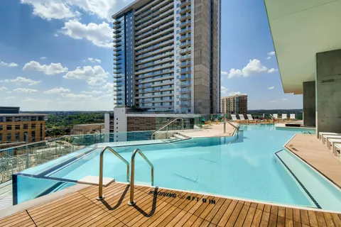 a swimming pool with chairs