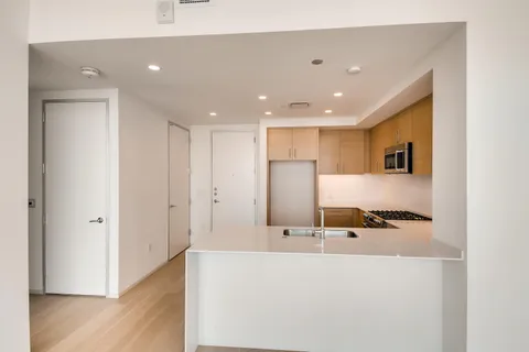 a large bathroom with a sink and a large mirror