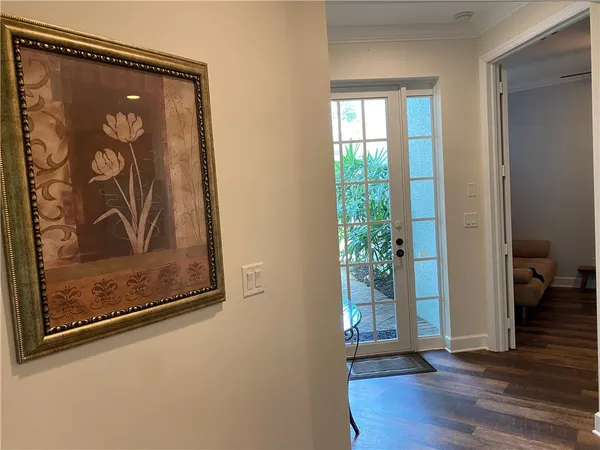 a view of a door with wooden floor