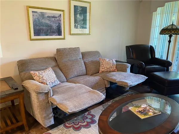 a living room with furniture and a rug