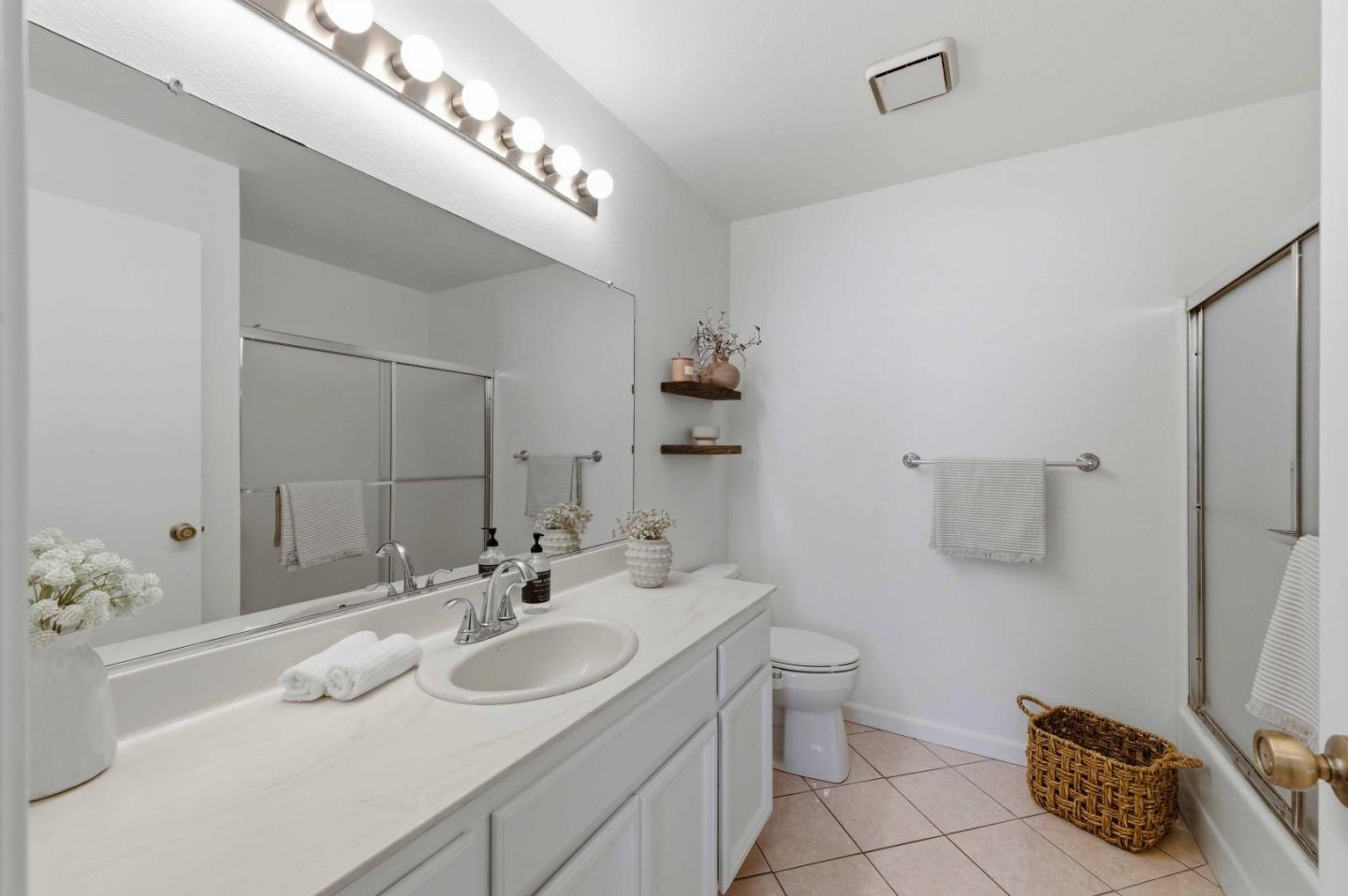 3115 Heather Ridge Drive San Jose, CA 95136 - Photo 13 of 22 a bathroom with a sink double vanity and a mirror