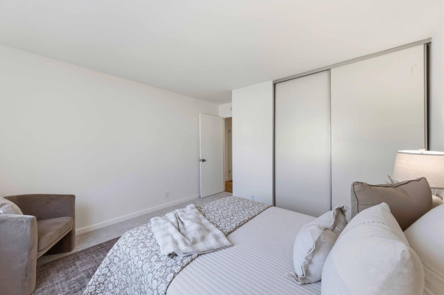 3115 Heather Ridge Drive San Jose, CA 95136 - Photo 18 of 22 a bedroom with a bed and a couch