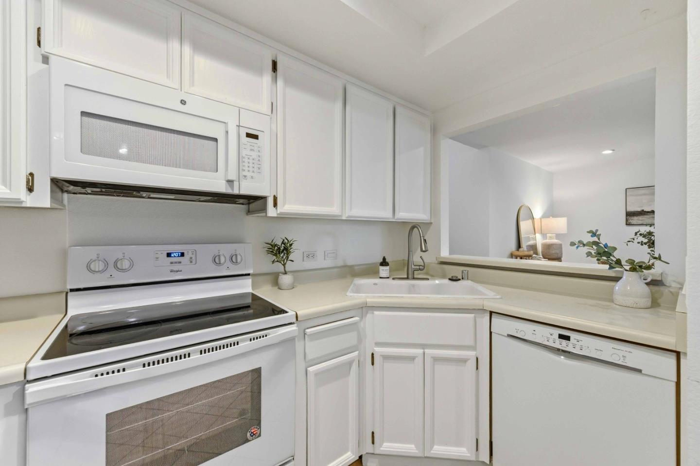 3115 Heather Ridge Drive San Jose, CA 95136 - Photo 9 of 22 a kitchen with cabinets appliances a sink and a counter top