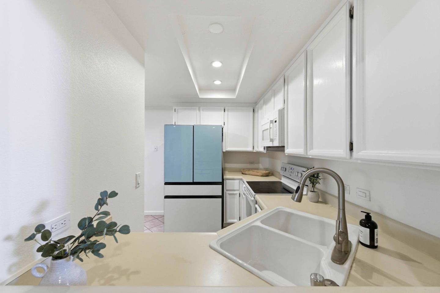 3115 Heather Ridge Drive San Jose, CA 95136 - Photo 10 of 22 a kitchen with a sink and cabinets