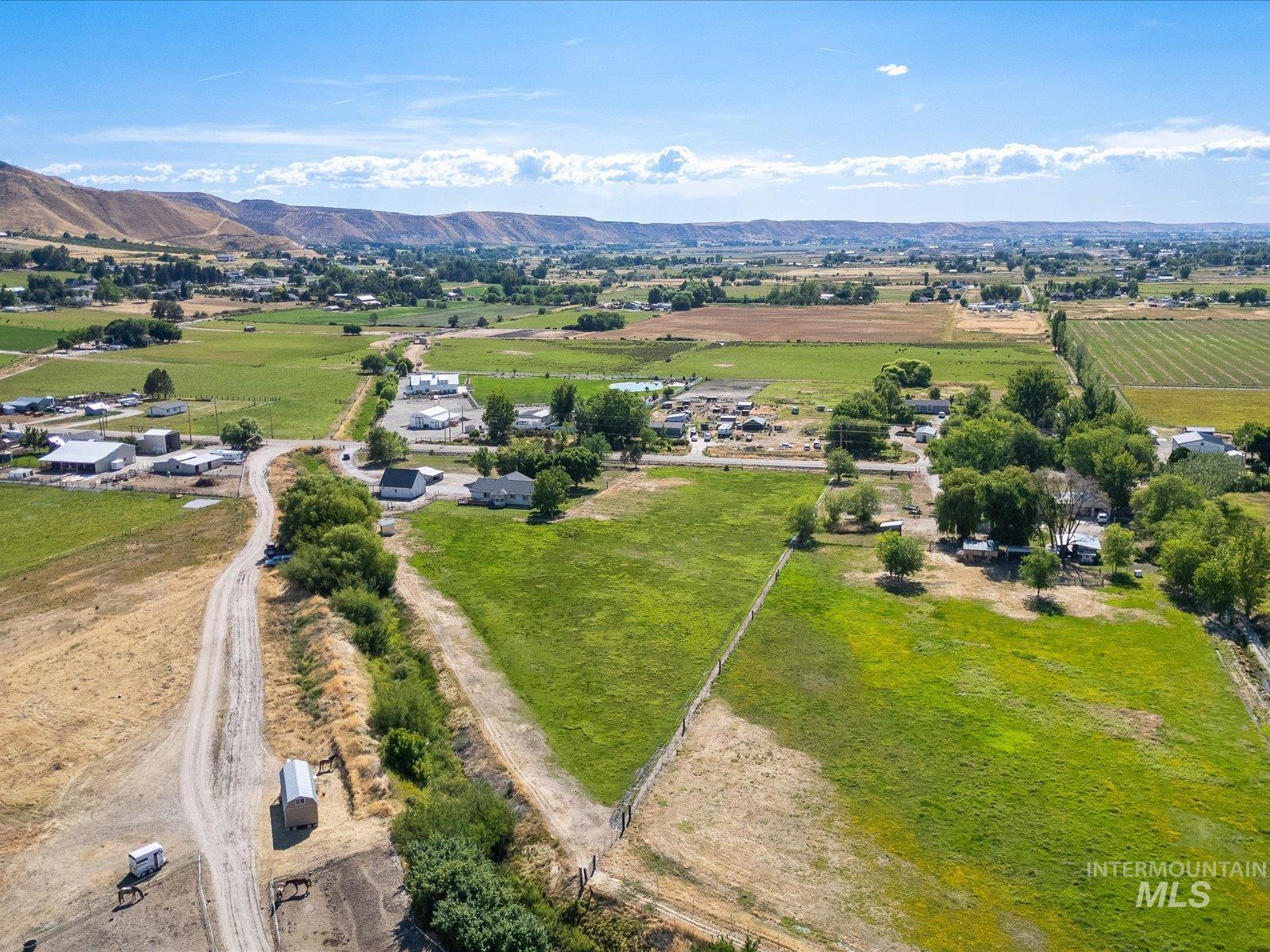 3540 Wills Road Emmett, ID 83617 - Photo 4 of 36 Expansive green fields with a mountainous backdrop