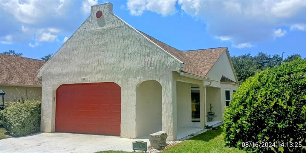 11543 Orleans Lane, Unit 11543 Port Richey, FL 34668 - Photo 1 of 13 a house view with a outdoor space