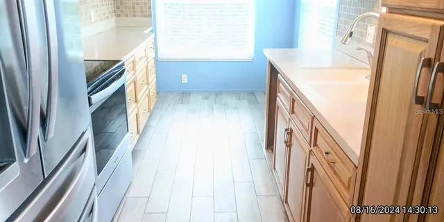 a view of an entryway with furniture and a window