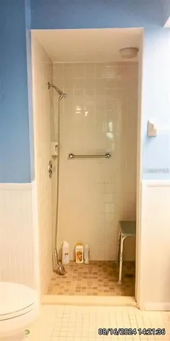 a living room with a flat screen tv and a window