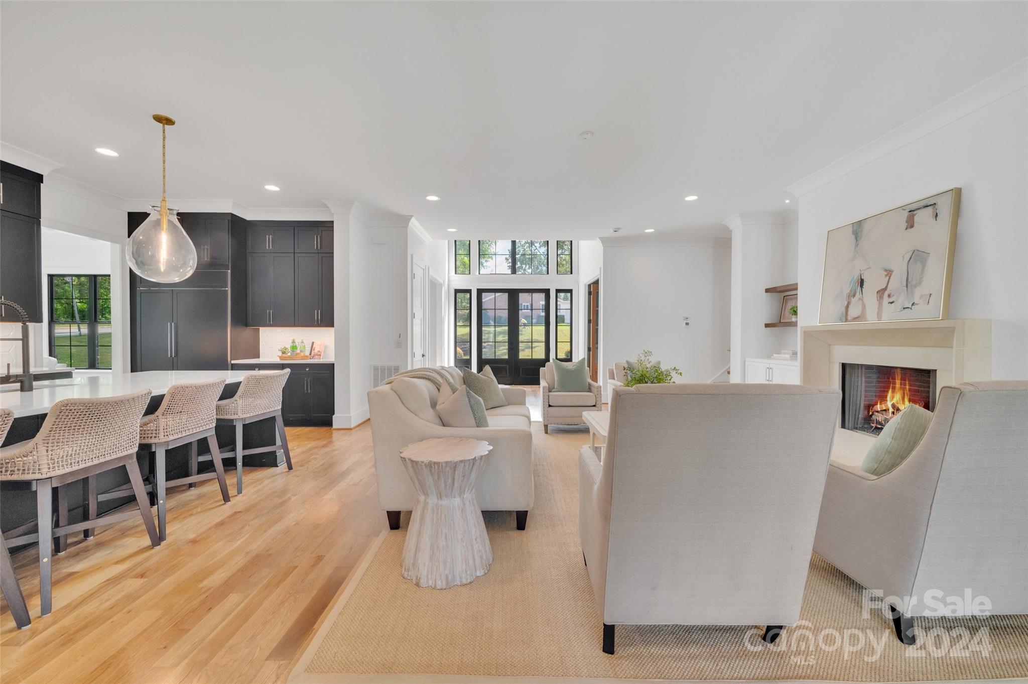 3500 Barclay Downs Drive Charlotte, NC 28209 - Photo 12 of 48 a living room with furniture a wooden floor and kitchen view